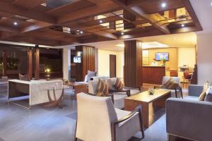 a restaurant with chairs and tables and a lobby at Mida De Sea Hua Hin - SHA PLUS in Cha Am