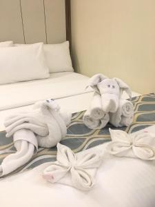 Belian Hotel tesisinde bir odada yatak veya yataklar
