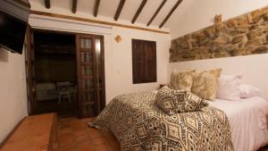 Säng eller sängar i ett rum på Casa Tzabar