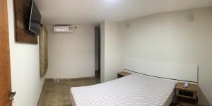 Voodi või voodid majutusasutuse Hotel Butantã toas