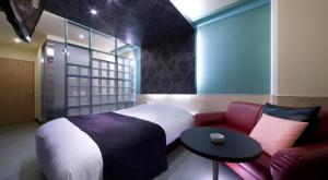 Кровать или кровати в номере Hotel Glow Yokkaichi (Adult Only)