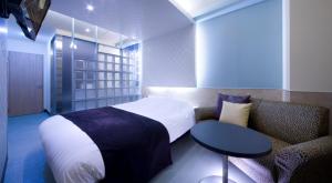 Кровать или кровати в номере Hotel Glow Yokkaichi (Adult Only)