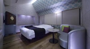 Кровать или кровати в номере Hotel Glow Yokkaichi (Adult Only)