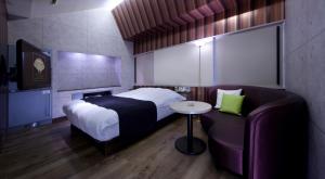 Кровать или кровати в номере Hotel Glow Yokkaichi (Adult Only)