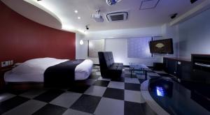 Кровать или кровати в номере Hotel Glow Yokkaichi (Adult Only)