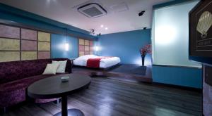 Кровать или кровати в номере Hotel Glow Yokkaichi (Adult Only)