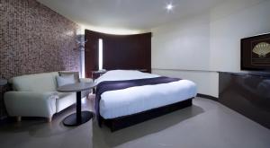 Кровать или кровати в номере Hotel Glow Yokkaichi (Adult Only)