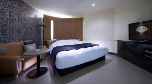 Кровать или кровати в номере Hotel Glow Yokkaichi (Adult Only)