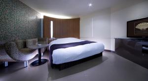 Кровать или кровати в номере Hotel Glow Yokkaichi (Adult Only)