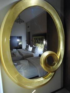 Postel nebo postele na pokoji v ubytování Ellinis Hotel