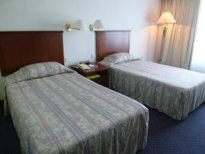 GOCOS Hotel客房内的一张或多张床位