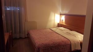 Postel nebo postele na pokoji v ubytování Hotel Edelweiss