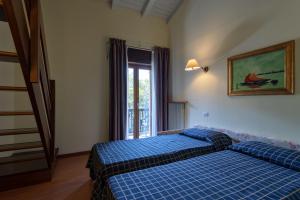 Ένα ή περισσότερα κρεβάτια σε δωμάτιο στο Hotel Malcesine