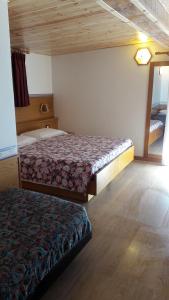 Postel nebo postele na pokoji v ubytování Hotel Edelweiss