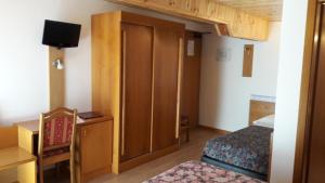 Postel nebo postele na pokoji v ubytování Hotel Edelweiss