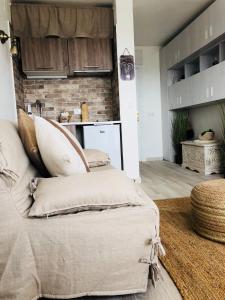 a bedroom with a bed with pillows on it at Beauté d un jour in Empuriabrava