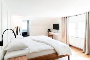 Postel nebo postele na pokoji v ubytování Hotel Zum Verwalter Dornbirn