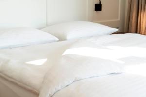 Postel nebo postele na pokoji v ubytování Hotel Zum Verwalter Dornbirn