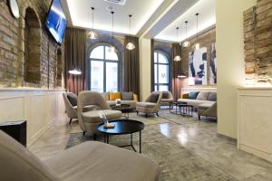 TV a/nebo společenská místnost v ubytování Marquise Hotel Garni