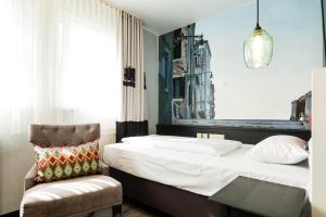 Postel nebo postele na pokoji v ubytování Best Western Hotel Nürnberg am Hauptbahnhof