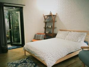 Postel nebo postele na pokoji v ubytování XiaoBei Home2