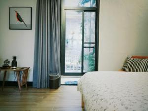 Postel nebo postele na pokoji v ubytování XiaoBei Home2