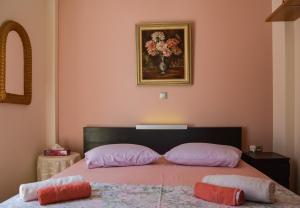 A bed or beds in a room at Serenity Villa-1st floor-Sea view- sea 150m away