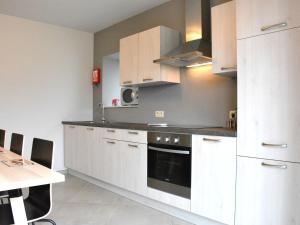 A kitchen or kitchenette at Vintage Holiday Home in Couvin near River