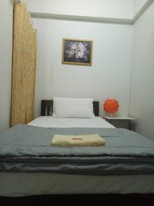 Rúm í herbergi á TT Hostel Chiangrai
