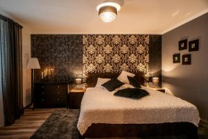 Ένα ή περισσότερα κρεβάτια σε δωμάτιο στο STING Apartments Havířov