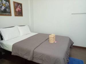 Rúm í herbergi á TT Hostel Chiangrai
