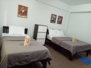 Кровать или кровати в номере TT Hostel Chiangrai