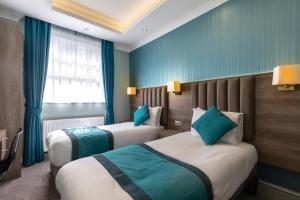 Postel nebo postele na pokoji v ubytování Sidney Hotel London-Victoria + 21 fotografií