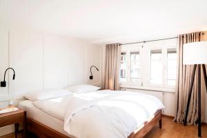 Postel nebo postele na pokoji v ubytování Hotel Zum Verwalter Dornbirn