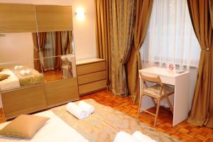 
A bed or beds in a room at Central Varna Apartment - Lets4Holiday

