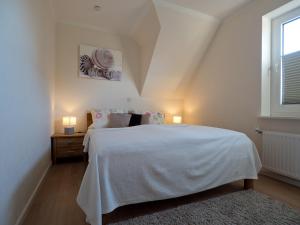 Postel nebo postele na pokoji v ubytování Appartement Lehnsweg 8, Büsum