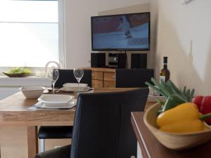 TV a/nebo společenská místnost v ubytování Appartement Lehnsweg 8, Büsum