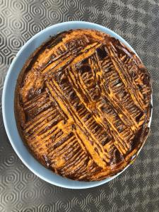 a cake on a plate on a table at Hotel-Restaurant Lann Roz / Côte Cuisine in Carnac
