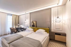 Posteľ alebo postele v izbe v ubytovaní Hotel Traugutta3