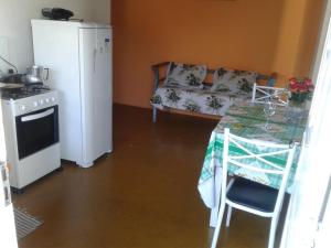 Virtuvė arba virtuvėlė apgyvendinimo įstaigoje Casa para temporada