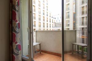 a balcony with a view of a building at Rental Apartments Warecka in Warsaw