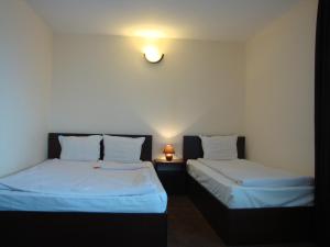 מיטה או מיטות בחדר ב-Family Hotel Diana