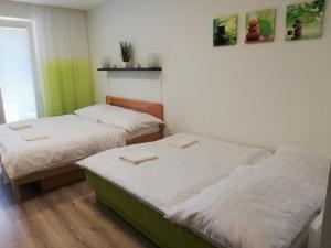 Postel nebo postele na pokoji v ubytování Apartmán Diamond