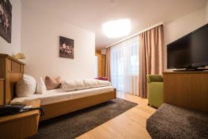 Postel nebo postele na pokoji v ubytování Naturparkhotel Adler