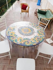 a table with a rug on top of it at Casa Nives in Villa Emilia in Vietri sul Mare