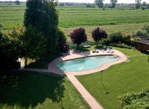 an overhead view of a swimming pool in a field at La Pioppa Agriturismo in Sacile