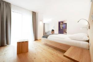 Posteľ alebo postele v izbe v ubytovaní Vegan Hotel La Vimea