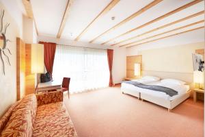 Postel nebo postele na pokoji v ubytování Vegan Hotel La Vimea + 37 fotografií