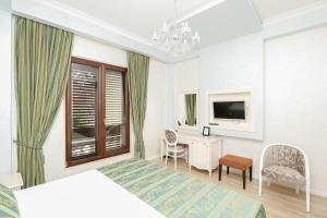 TV a/nebo společenská místnost v ubytování Oxford hotel