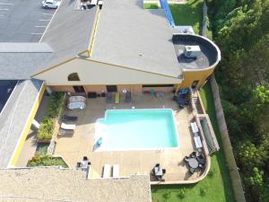 an aerial view of a house with a swimming pool at Quality Inn South Boston - Danville East in South Boston